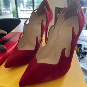 Christian Louboutin red suede stilleto heels.